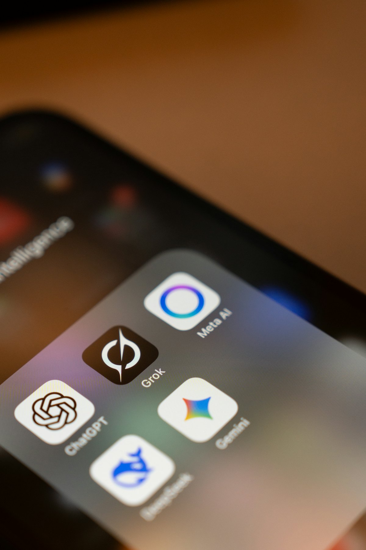 A smartphone home screen showing the app icons for several AI assistants side by side.